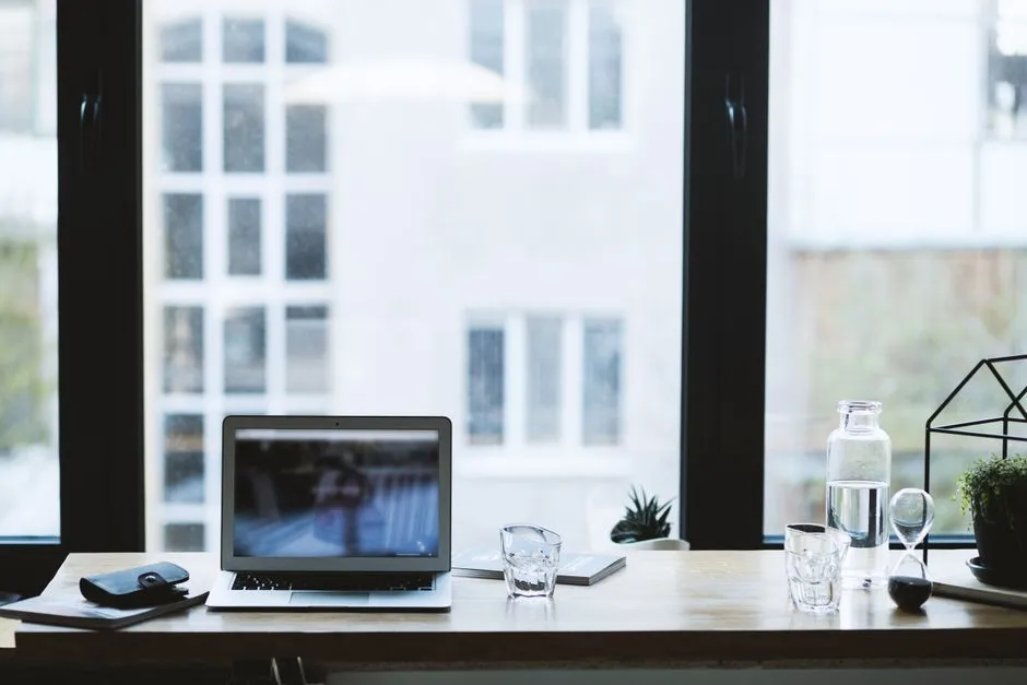 A simple home desk setup with a laptop, used as a dedicated work spot.